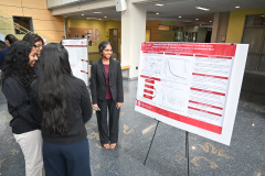 Photo of attendees viewing posters.